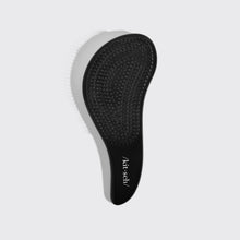 Load image into Gallery viewer, Black hairbrush with &#39;kitsch&#39; branding on a light gray background
